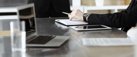 Business presentation. Unknown businessman giving a speech to colleagues or partners at corporate...