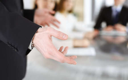 Business presentation. Unknown businessman giving a speech to colleagues or partners at corporate conference. Meeting conceptの写真素材