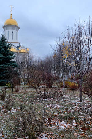 Golden domes with Christian crosses of the Monastery of Russian Orthodox Church on the gray cloudy sky background. Faith And Christianity.の写真素材