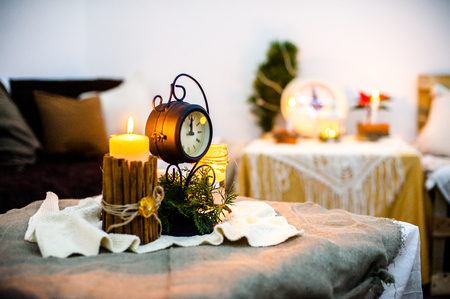 New Year's candle on a festive table warm colorsの写真素材