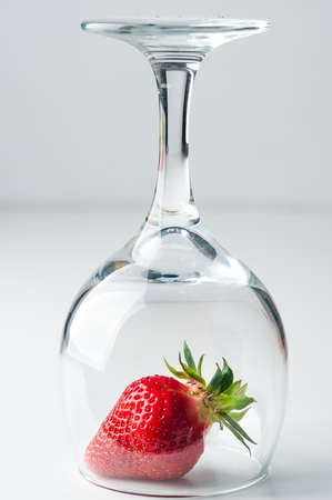 scattered strawberries on a white backgroundの写真素材