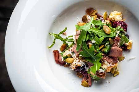 Veal Salad. Autumn composition with pumpkin. halloween Black background and bright colorsの写真素材