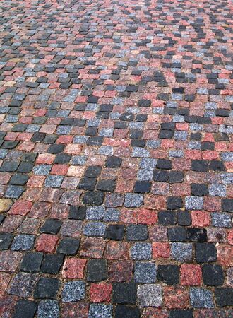 Old cobblestone pavement texture, background verticalの写真素材