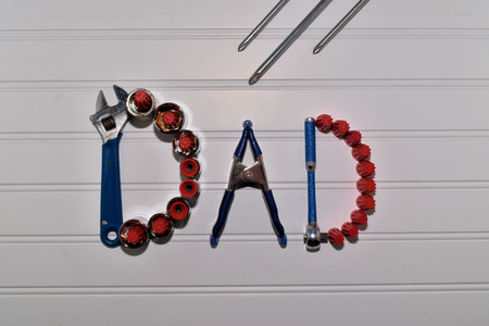 Dad spelled out with Tools and Workshop Objects