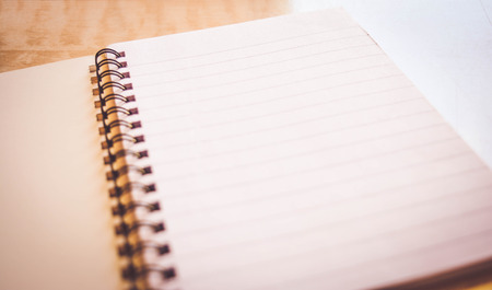 notebook on wooden tableの写真素材