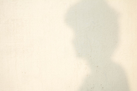 shadow of human head on abstract wallの写真素材