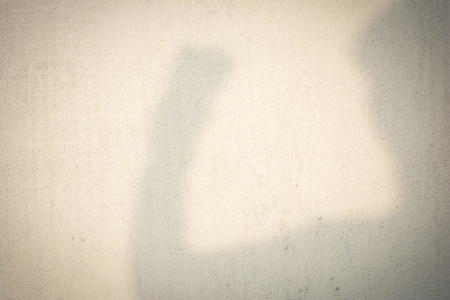 shadow of human head on abstract wallの写真素材