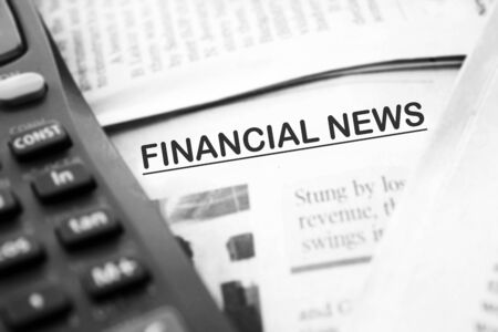 stack of newspapers isolated on white backgroundの写真素材