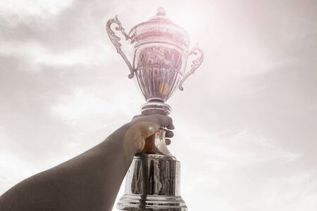 winner trophy on sky backgroundの写真素材