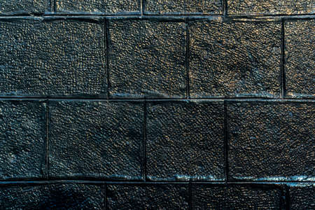 dark stone wall textured backgroundの写真素材