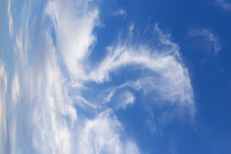 Blue sky background with white clouds. Clouds in the blue sky.