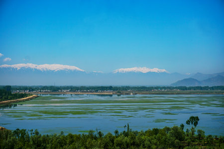 landscape scenery view of a lake and mountains under the blue skyの写真素材