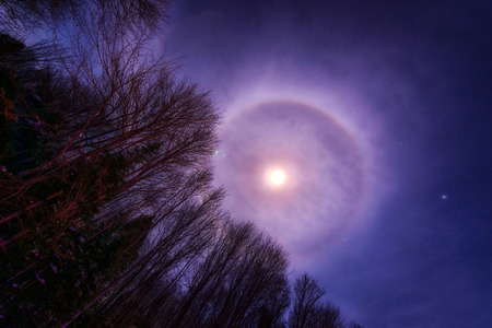 Photo of the night sky featuring a Moon or Halo on a winterの写真素材