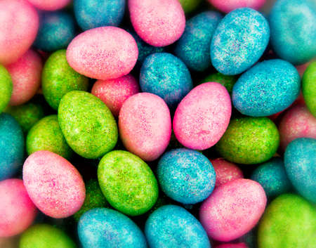 Close up of numerous glitter coated mini eggs  