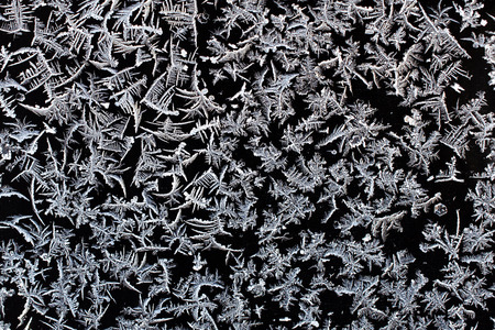 Real frost crystals on a black surface    This image makes a great background or texture layer to...