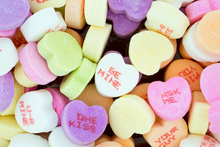 A detailed close up of colorful valentines candy with different words on themの写真素材