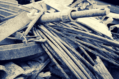 A close up of a pile of old corroding scrap metal.  Toned in Sepia.の写真素材