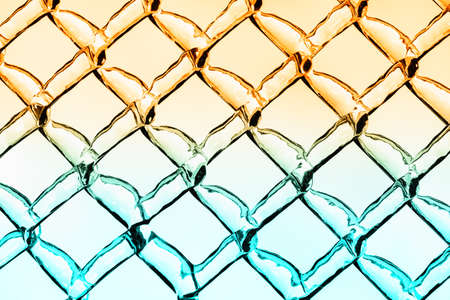 A close up abstract background image of a chain link fence. 