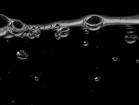 Water abstract background. A bubbles on a clear liquid surfaceの写真素材