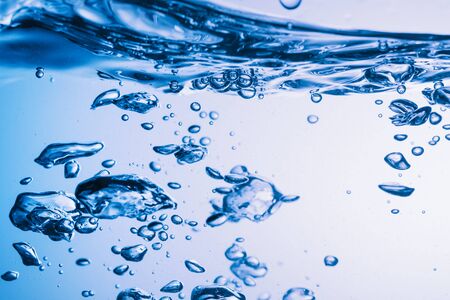 Clear water surface with ripple and bubble
