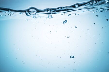 Clear water surface with ripple and bubble