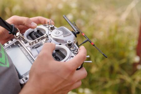 Drone copter remote telemetry controller in male handsの写真素材