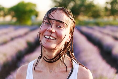 Beautiful happy smiling girl with wet hair