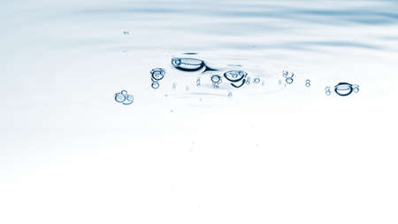 Water blue nature background. Bubbles on the clear water liquid surface