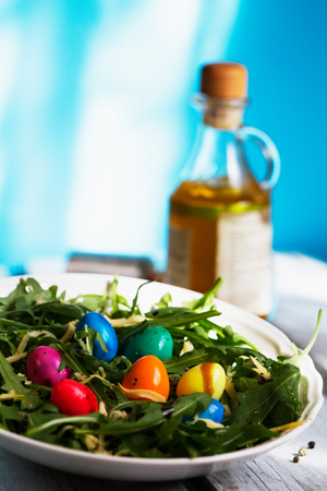 Easter salad from arugula and colored quail eggsの写真素材