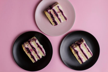 piece of birthday cake on a pink background