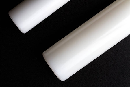 rolling-pin baked white plastic on black backgroundの写真素材