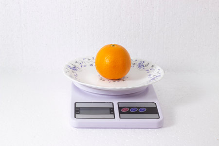 peeled tangerines that lie on the scales and look very appetizingの写真素材