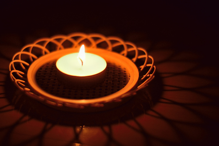 Burning Candle  light reflections on Diwali night, an Indian festivalの写真素材
