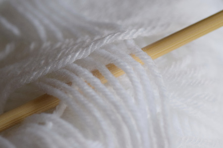 Macro details of soft wool with knitting needle in horizontal frameの写真素材