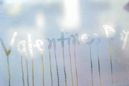 Texture of water droplets on clear window glass with Valentines Day textの写真素材