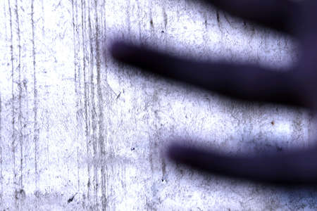 Fingers shadow on wall