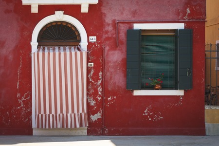 The Red House on the island of Burano, Italyの写真素材