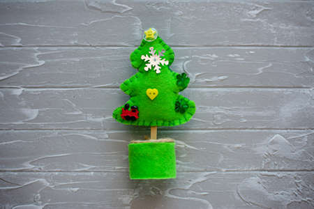 Merry Christmas tree project for kids. DIY Christmas tree felt decoration. Children's crafts. Kids crafts for Christmas. Top view. Flat lay.の写真素材