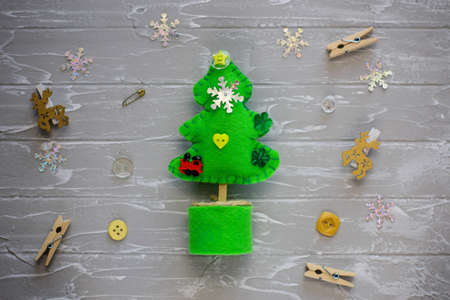Merry Christmas tree project for kids. DIY Christmas tree felt decoration. Children's crafts. Kids crafts for Christmas. Top view. Flat lay.の写真素材