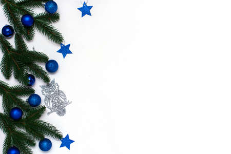 Christmas flatlay with fir branches, blue and silver decorations on white background. Christmas composition, top view, copy space.の写真素材