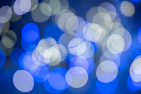 Blue bokeh, blurred background, christmas background. Neon color.の写真素材