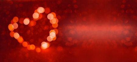 Valentine's Day background, bokeh red heart. Red glitter sparkle confetti. Invitation to the Happy birthday party.の写真素材