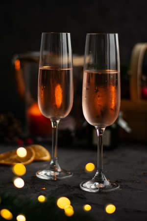 Glasses of rose champagne on blurred dark backgrounde, bokeh. Celebration concept. New year. Valentines day.の写真素材