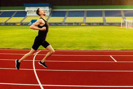 Happy athlete won the stadium race. Sport winnerの写真素材