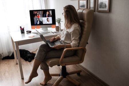 Video business conference. Young director holds a video conference from home.の写真素材