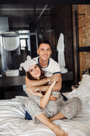 Perfect couple in pajamas at the morning. Love story.の写真素材