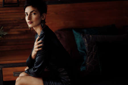 Beautiful female owner of the company, looking at the camera, smiling. Gorgeous business lady posing...