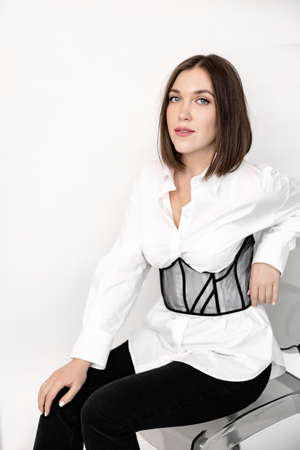 Portrait of an attractive young business woman, looking at the camera, happy about a promotion....