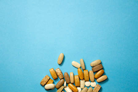Lot of white capsules as medical background. Top view.