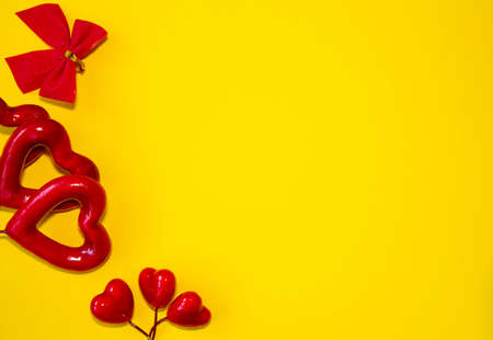 Valentines day congratulation. Red rose and greeting card with heart sign on black background top...